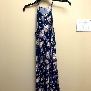 Small flowy halter dress with a small slit in the chest area.